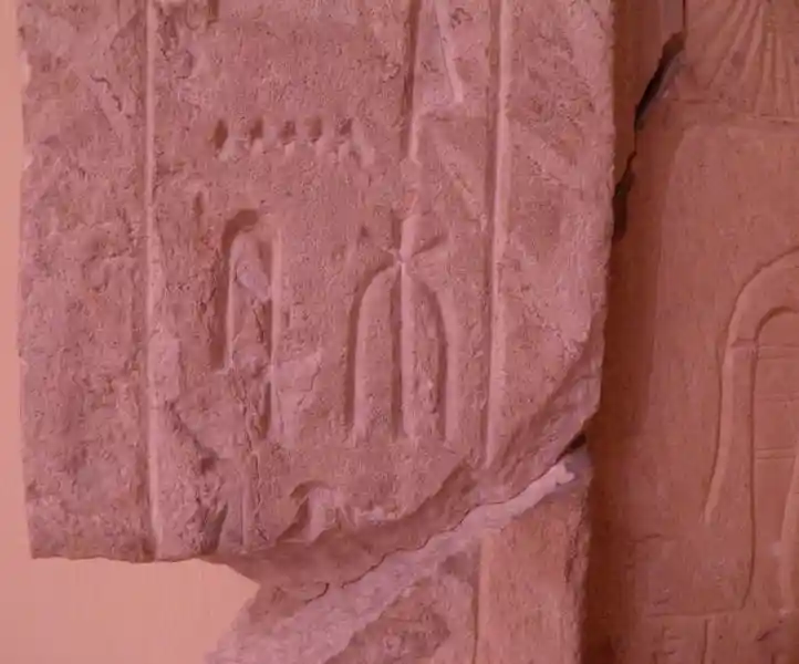 Six-pointed, asymmetrical cross engraved on a funerary stele.